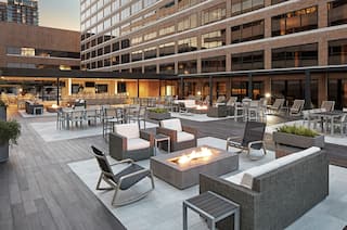 Rooftop patio with fire pit and seating