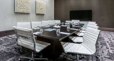 Boardroom with Conference Table and Wall Mounted TV