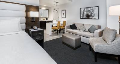 Suite with King Bed, Lounge Seating, Work Desk and Wet Bar Kitchen