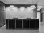 Front desk in lobby area with lamps