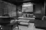 The Pearl Bar with comfortable seating area, table and art on wall