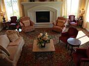 Mixed Seating Around Fireplace in Lobby Lounge With Windows