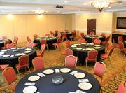 Place Settings and Black Linens on Round Tables and Overhead Projector in Venitian Ballroom