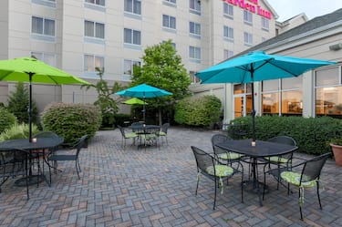 Three Tables With Sun Umbrellas on Outdoor Seating Area