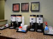 Coffee station with art displayed on wall