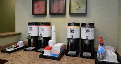Coffee station with art displayed on wall