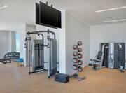 Fitness Center with Screens Hanging from Ceiling