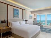 Bed in Hotel Room With Sea View