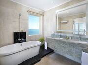 Bathroom in Hotel Suite with a Standalone Pedestal Tub