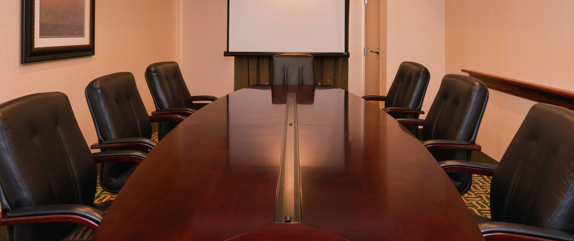Projector Screen and Seating For 7 at Private Boardroom Table