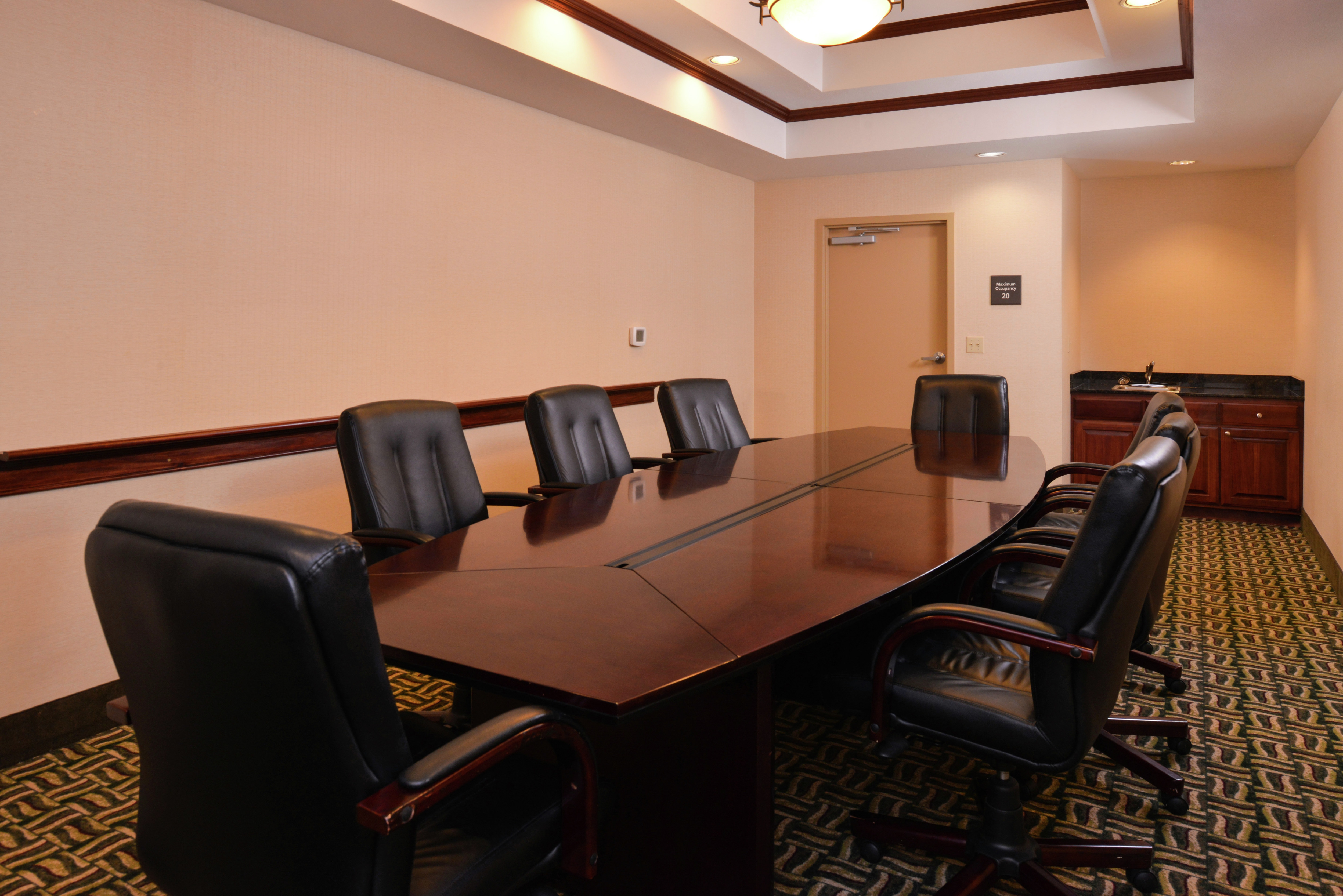 Seating For 8 at Private Boardroom Table, Entry, and Wet Bar