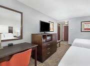 Two Queen Guestroom with Work Desk and Television