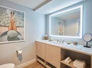 Bathroom Vanity Area with Lit Mirror