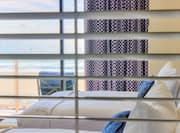 View of Guestroom Bed through Blinds