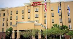 Hampton Inn and Suites Hotel Exterior with Flags