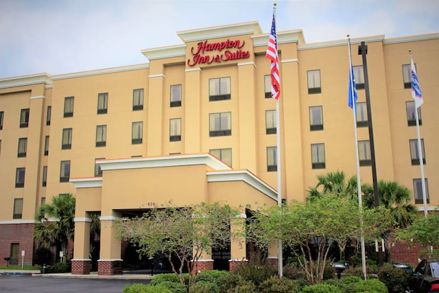 Hampton Inn and Suites Hotel Exterior with Flags