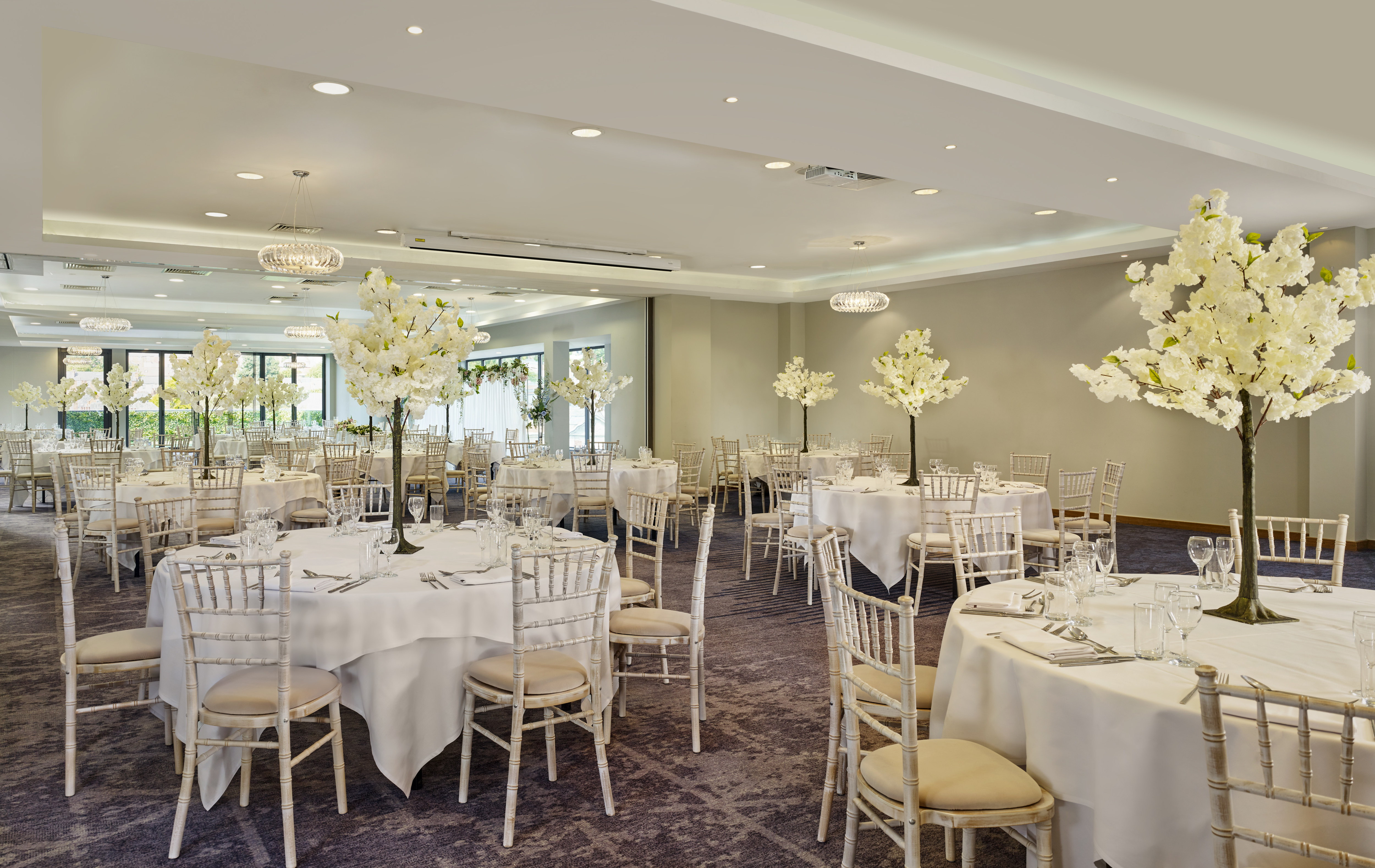 ballroom with wedding reception setup and round tables