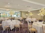 ballroom with wedding reception setup and round tables