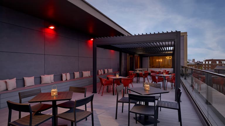 rooftop outdoor patio area with tables and chairs