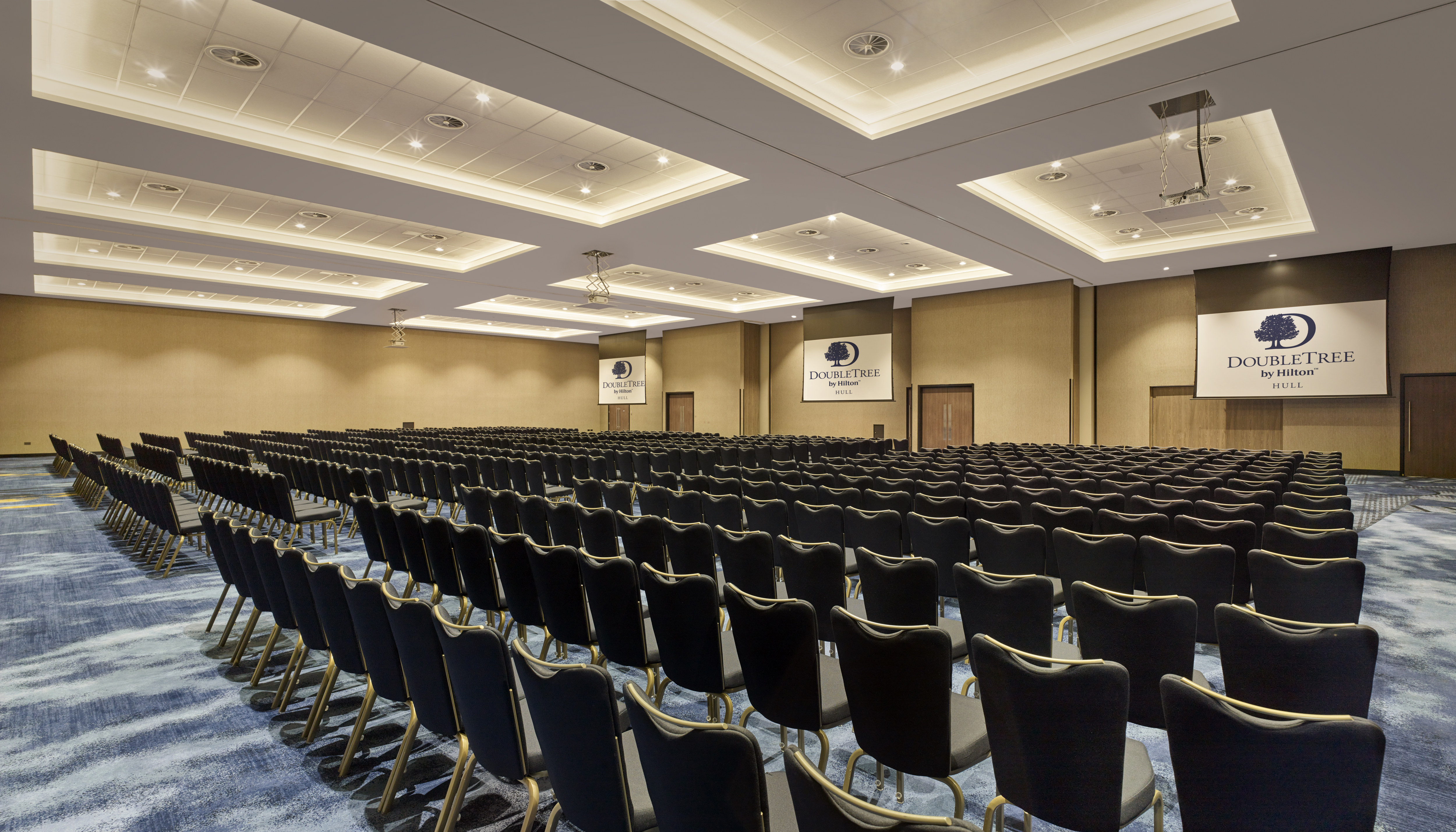 conference setup in ballroom with rows of chairs