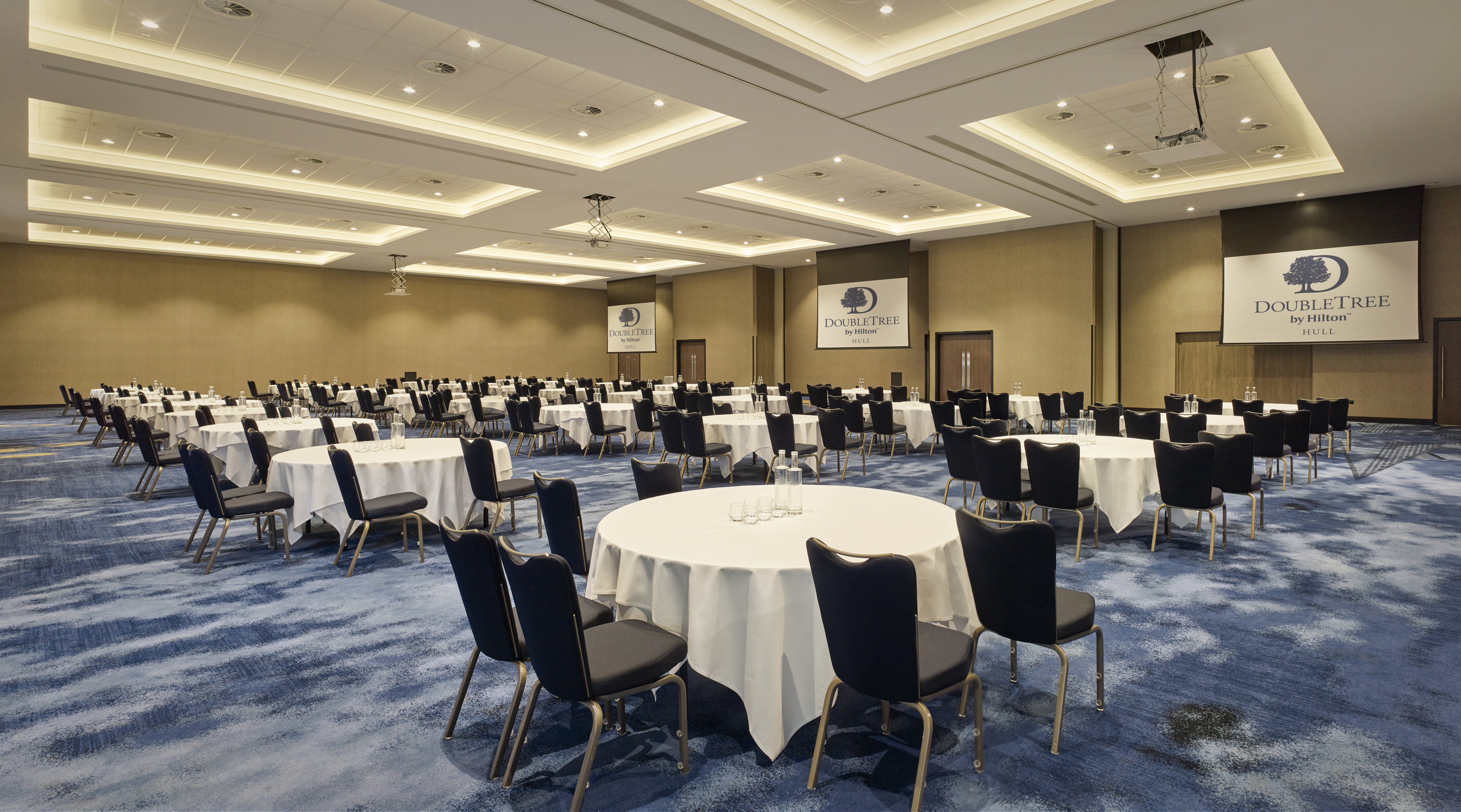 ballroom with round tables for conference setup