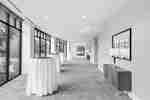 Ballroom Foyer with Round Tables and Large Windows