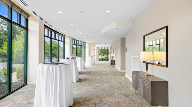 Ballroom Foyer with Round Tables and Large Windows