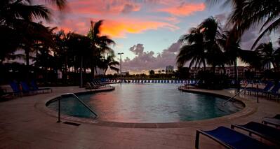 Pool Deck with beautiful sunset inbackground