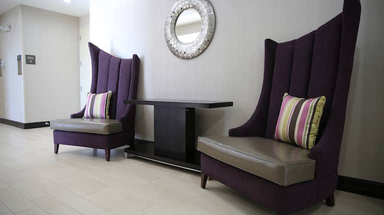 Resting Area with Two Large Chairs in the Hallway