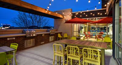 exterior patio with barbeques at dusk