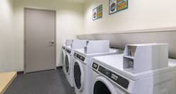 Guest Laundry Room with Coin-Operated Washing Machine