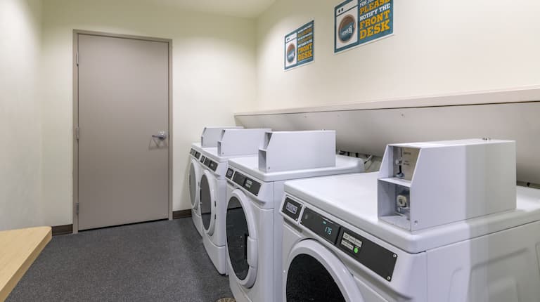 Guest Laundry Room with Coin-Operated Washing Machine
