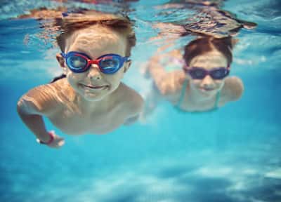 Kids Swimming under Water