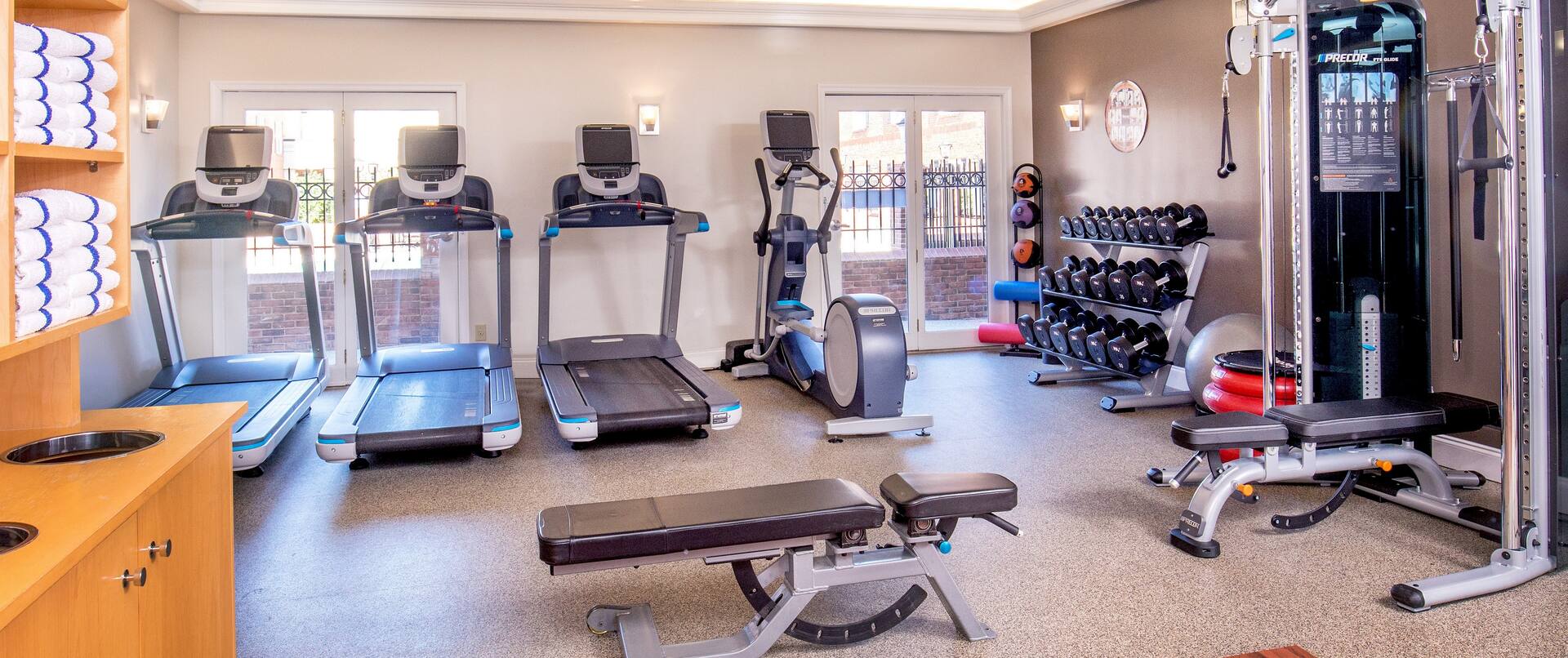 Fitness Center With Towel Station, Cardio Equipment, Weight Balls, Free Weights, Stability Ball, Aerobic Stepper, Weight Machine, and Bench