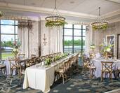Wedding Reception with Elegant Table Settings and Waterfront View
