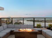 Rooftop Bar and Lounge Area with Fire Pit and Scenic Overlook