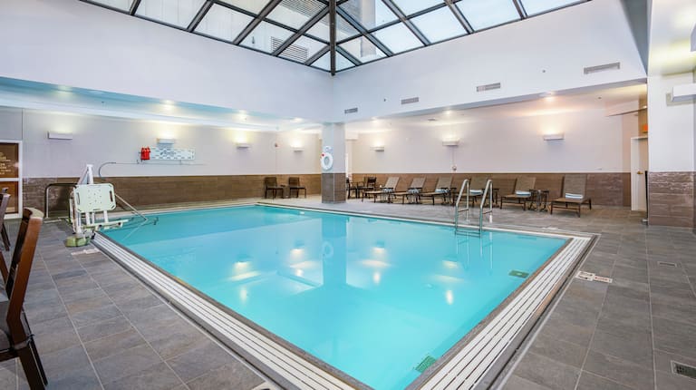 Indoor Pool Area with Lounge Chairs