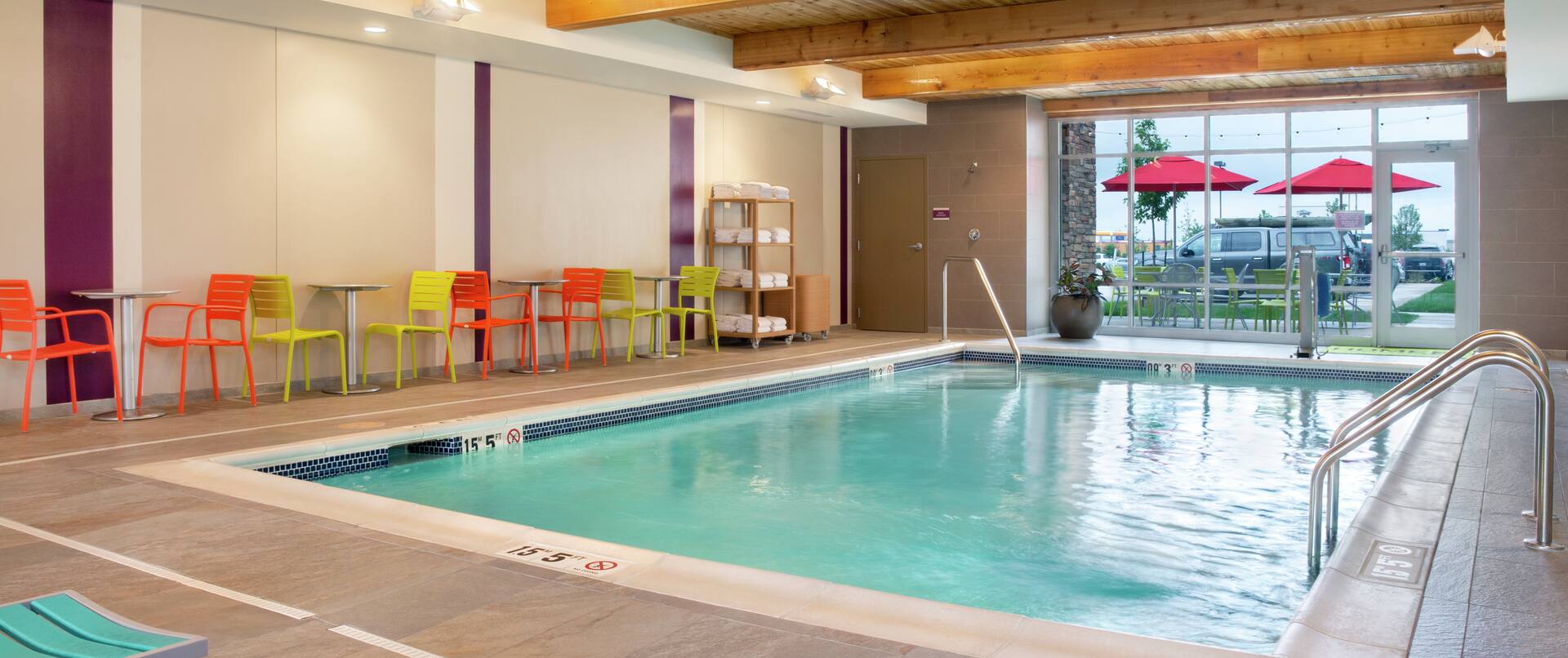 An Indoor Pool and Lounge Chairs