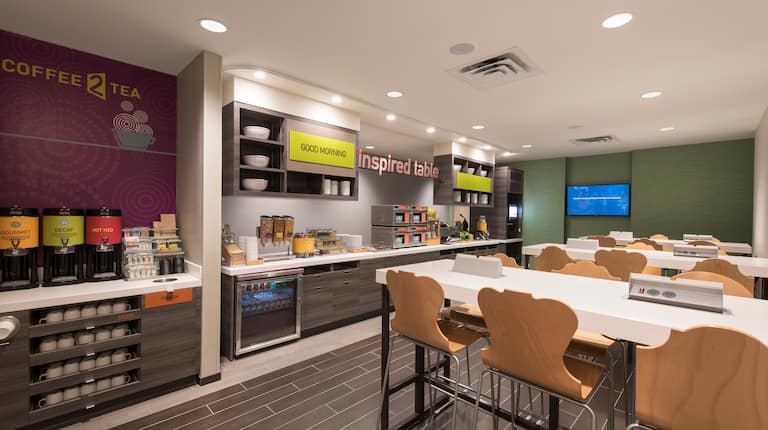 Hot Beverage Station, Breakfast Counter with Hot and Cold Foods and Counter Style Seating in Dining Area