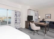One King Bed Guest Suite with Work Desk, HDTV and Sofa