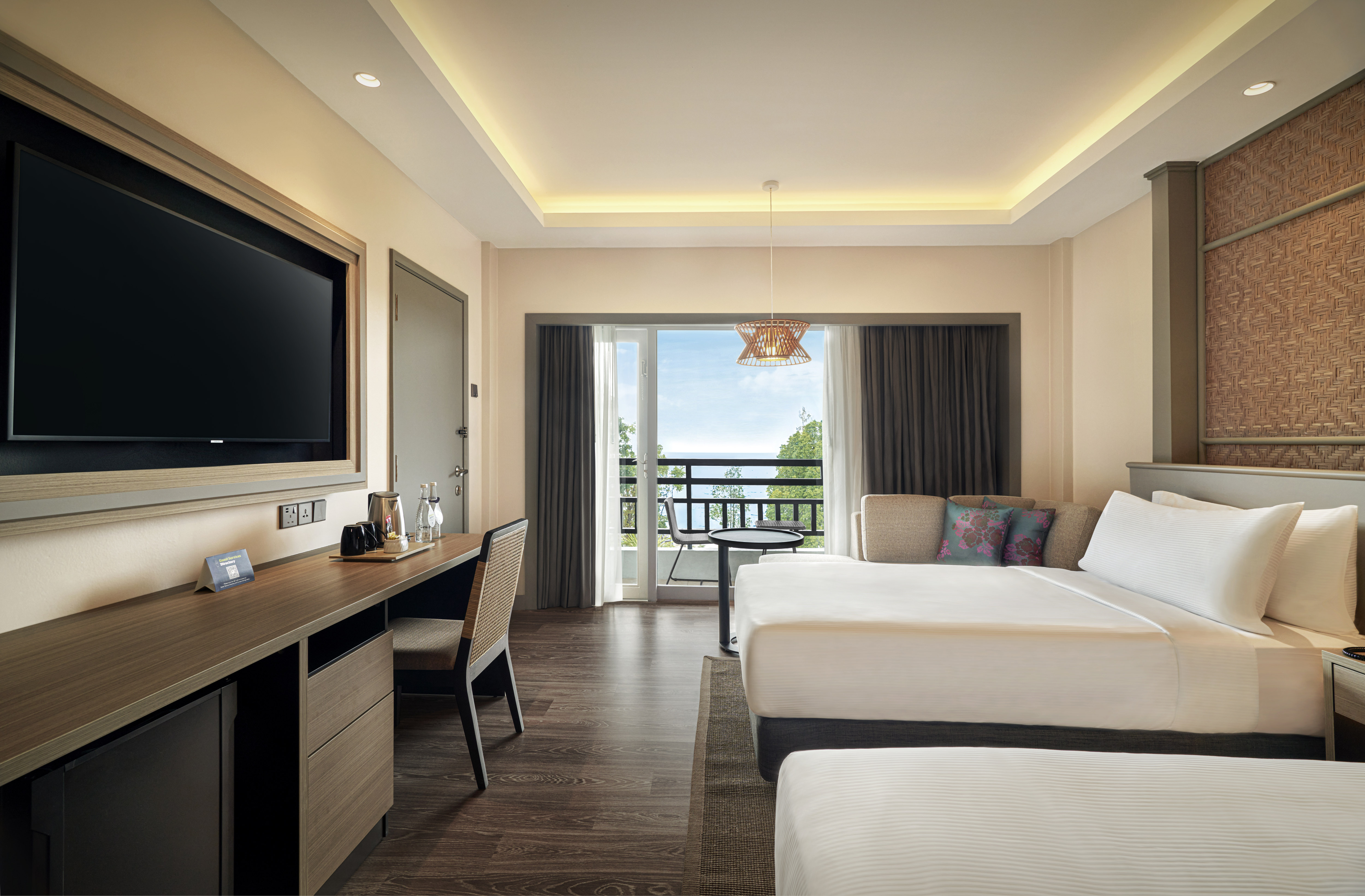 Twin beds room with balcony, sea view and wall mounted TV
