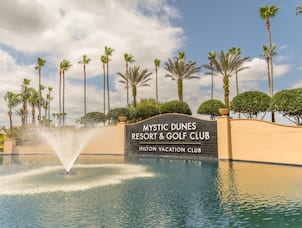Outdoor Pool Area with Mystic Dunes Resort and Golf Club Sign
