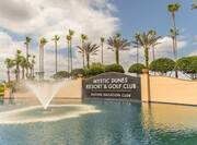 Outdoor Pool Area with Mystic Dunes Resort and Golf Club Sign