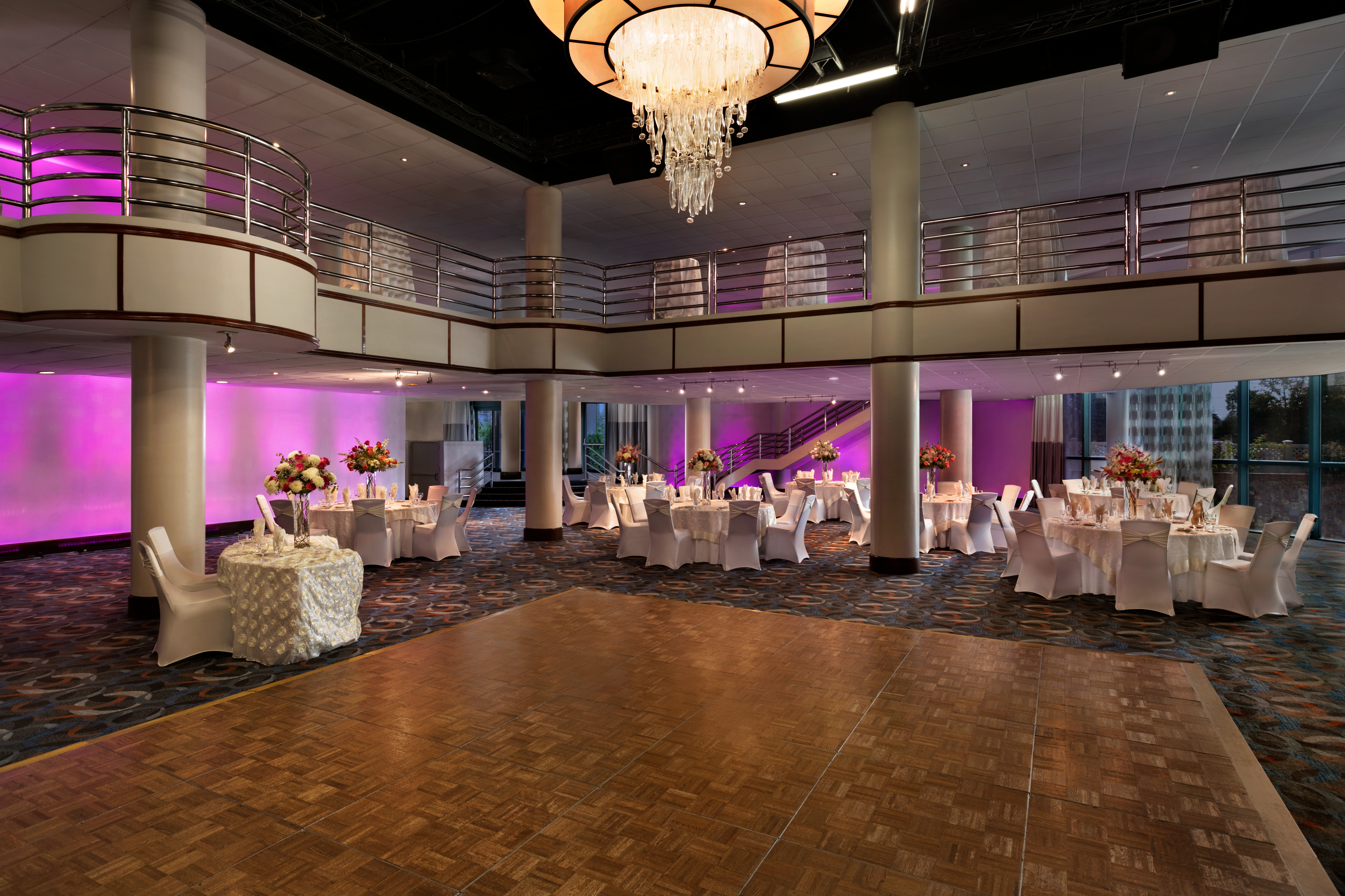  Social Setting with Seating, Tables, and Magenta Lighting in the Savoy Ballroom 