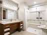 The spacious and clean-lined accessible bathroom with roll-in shower