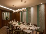Private Dining Room With Place Setting and Candles on Table
