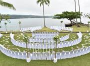 Seating for wedding ceremony in hotel grounds overlooking the sea