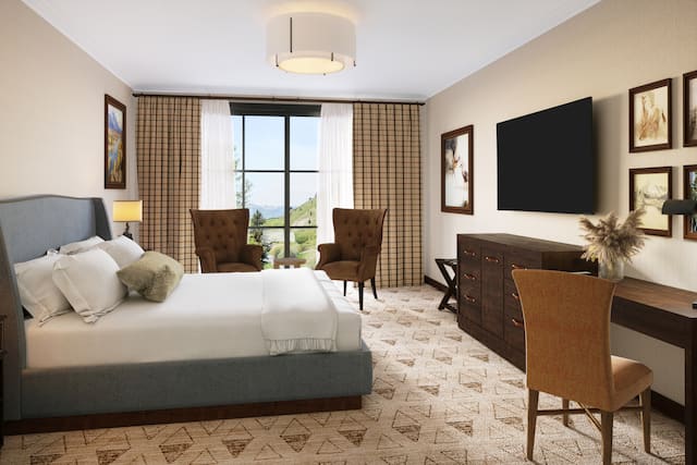 客房大睡床、高清电视、办公桌和休息区