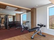 Fitness center with weight bench and free weights