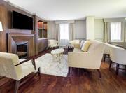 Presidential Suite Lounge Area with Television and Fireplace 